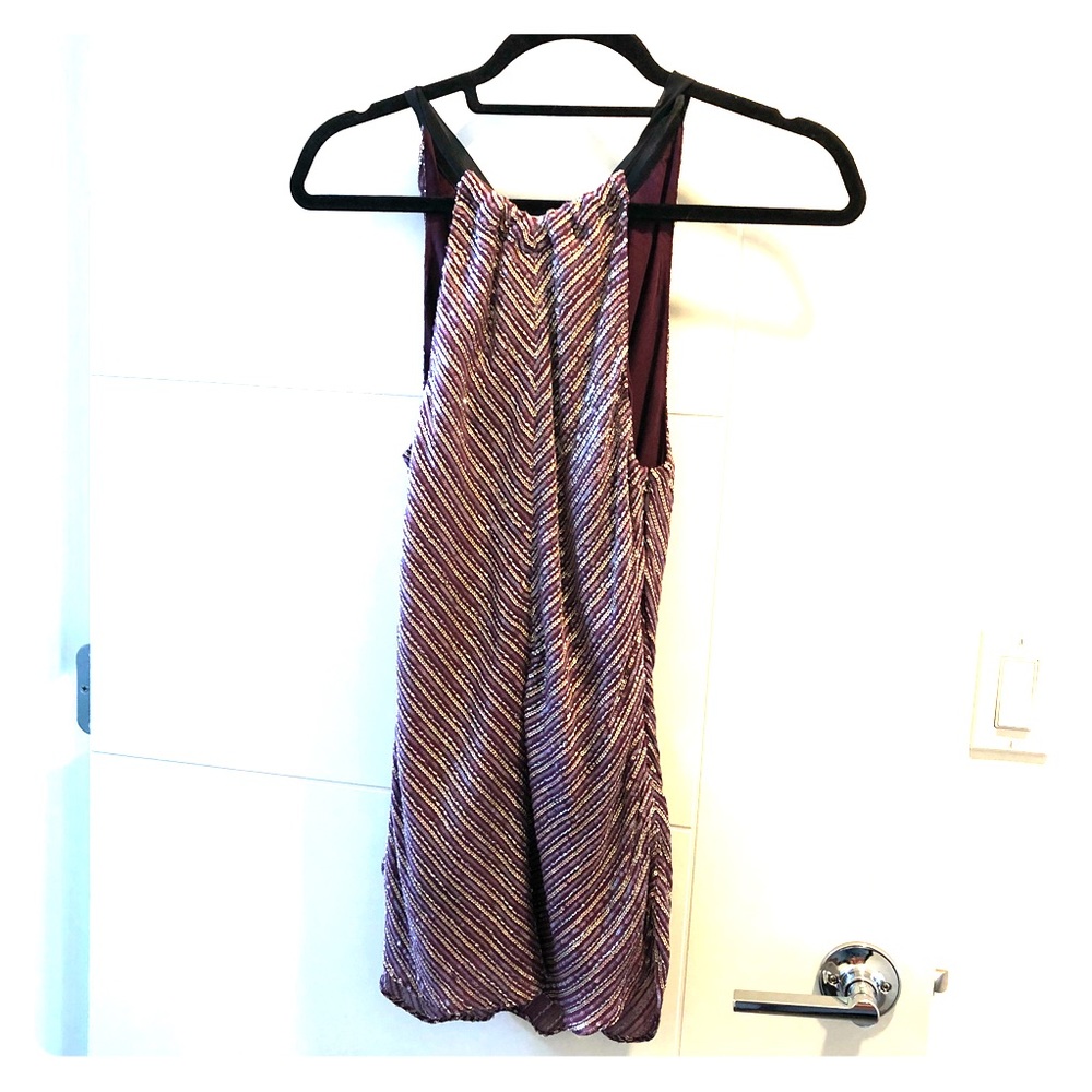 Beautiful sequin top with round open back.
